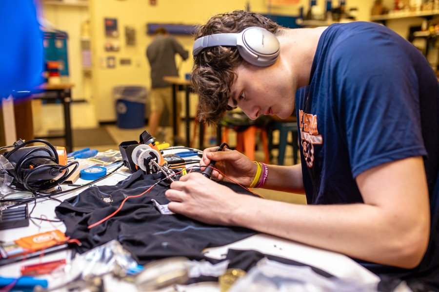 Aiden Mess ’26, a member of the men’s basketball team working on a project