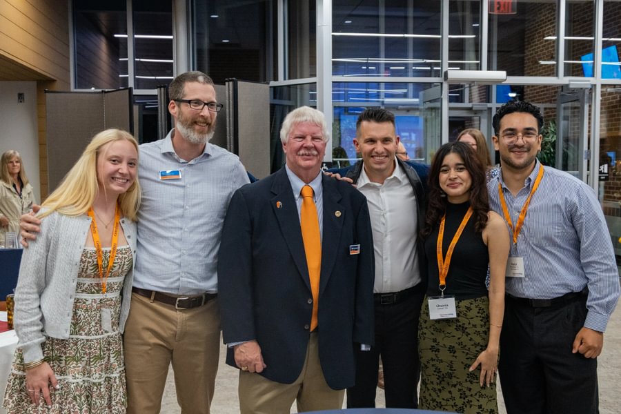 Staff and students stand with GLC founder Bob Garthwait, Jr. &rsquo;82.