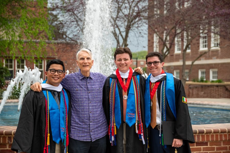 Carl DeMarco Jr. ’25 alongside classmates and Political Science Prof. Bruce Larson.