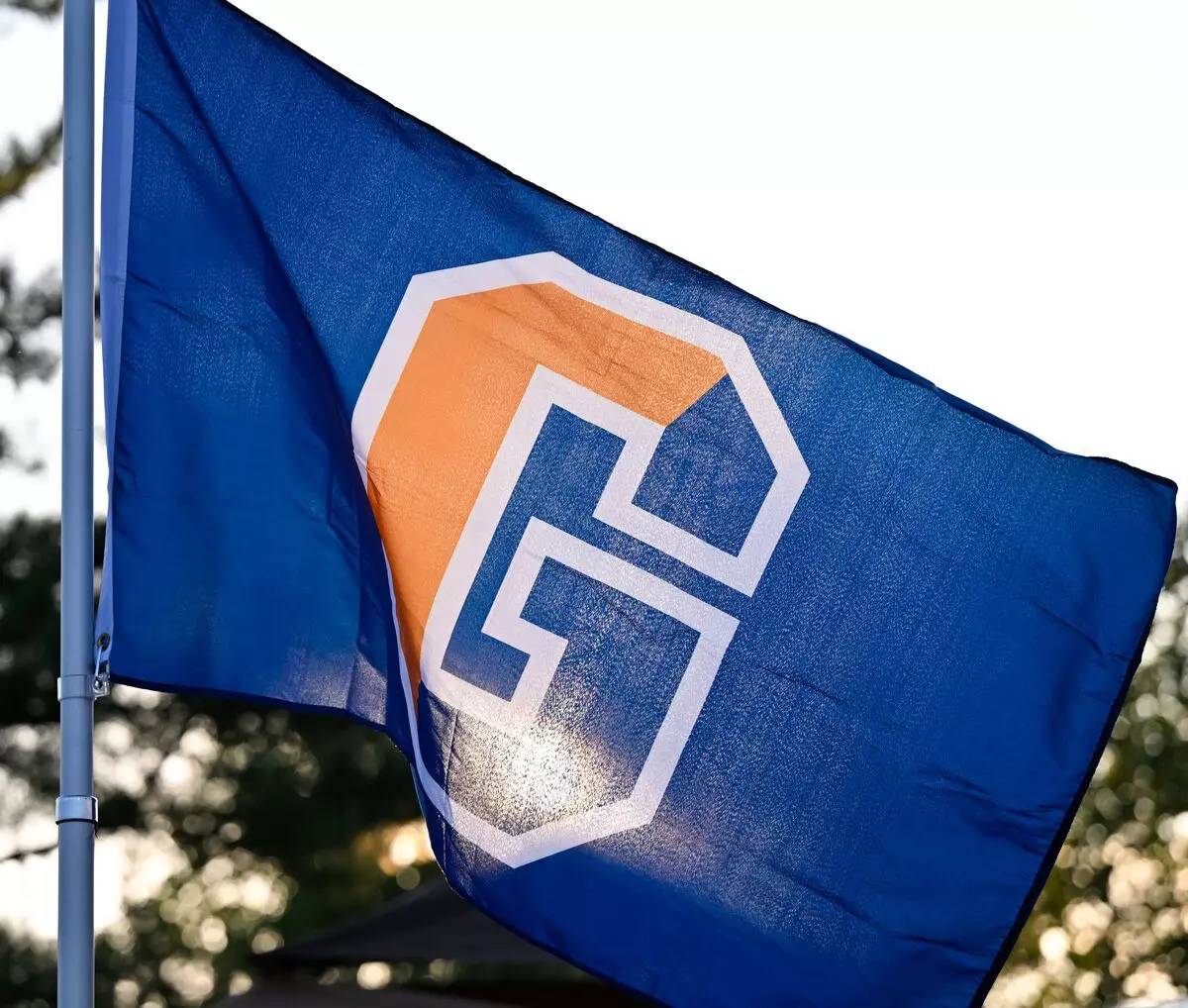 Gettysburg College flag waving outdoors.